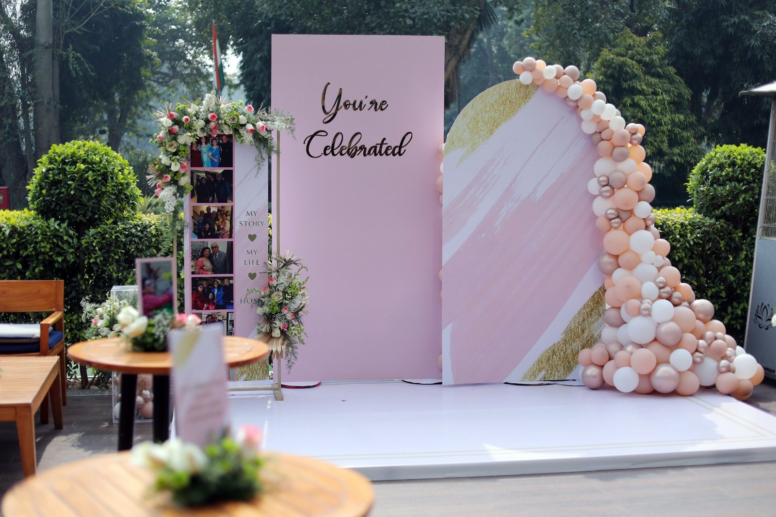 "You're Celebrated" floral balloon arch