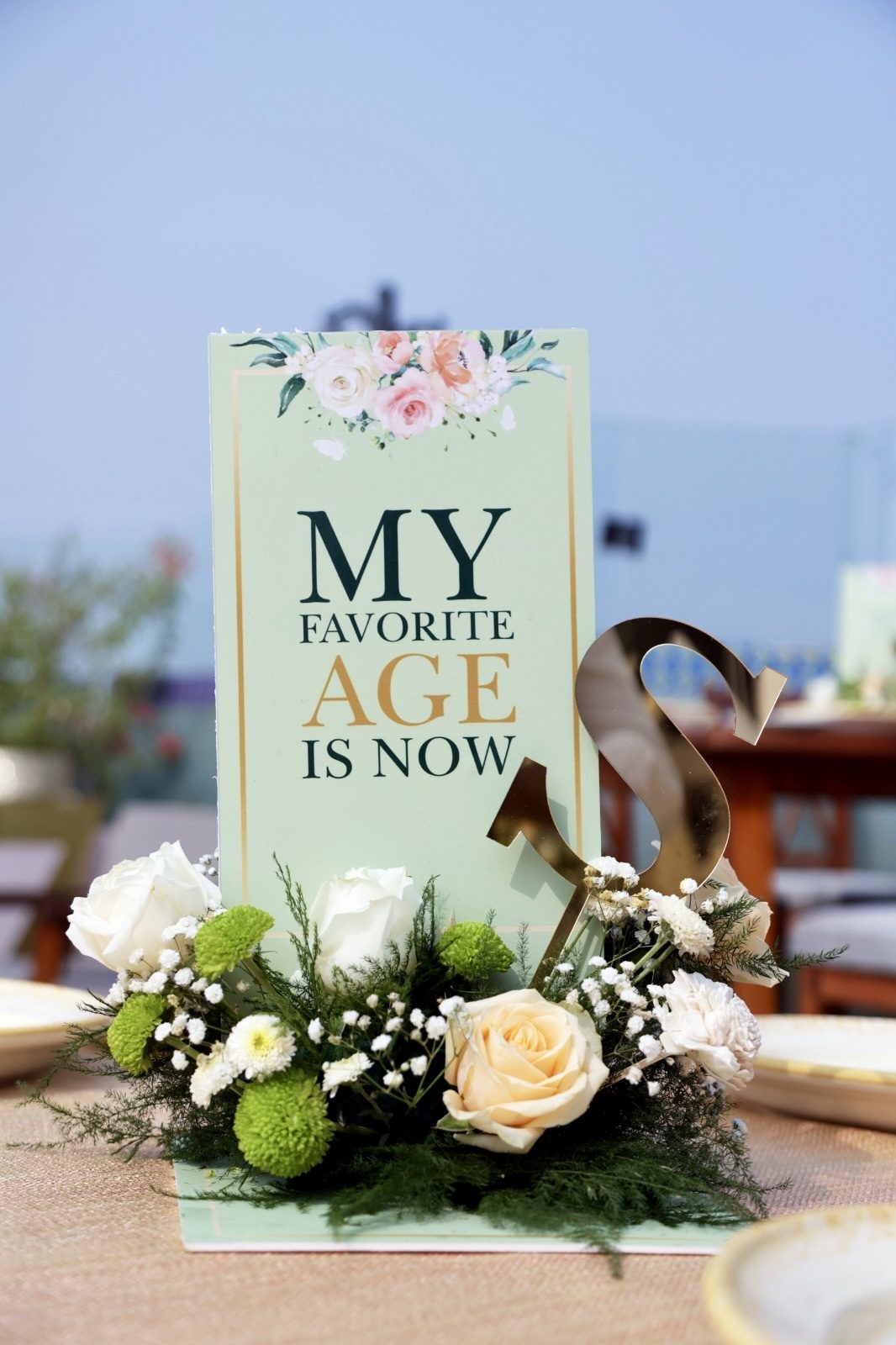 "My Favorite Age Is Now" floral standee
