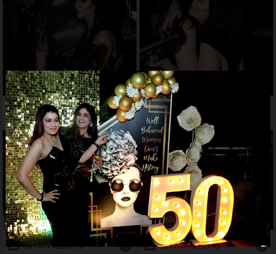 Party photo booth with glitter backdrop and 50 sign