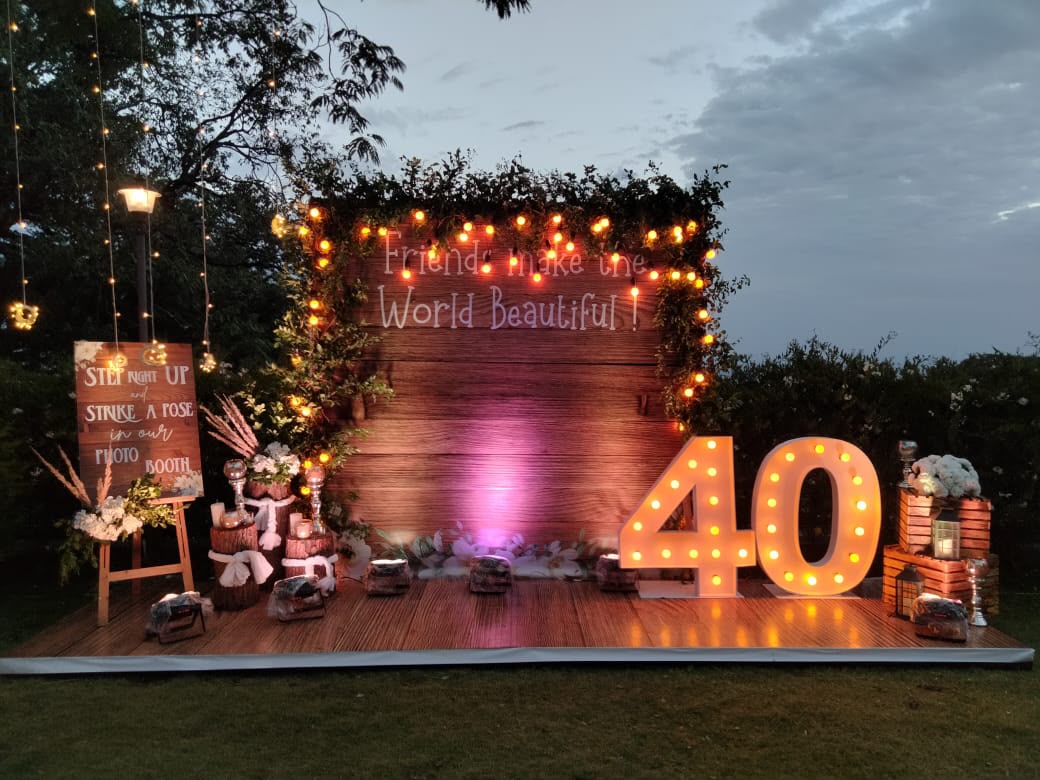40th birthday photo booth backdrop with fairy lights