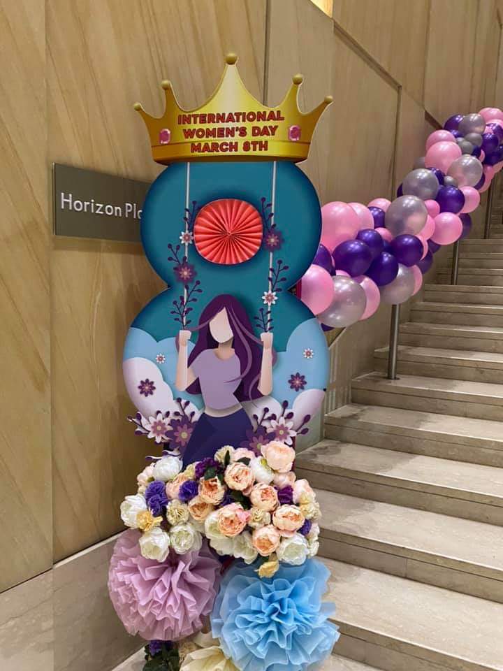 International Women's Day floral swing backdrop