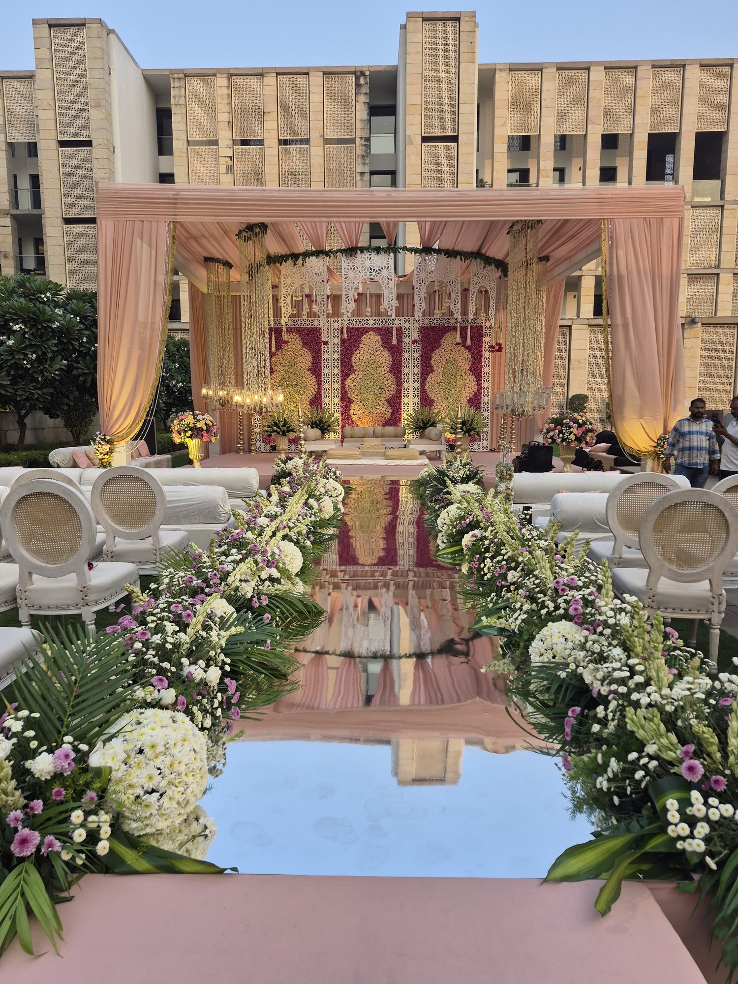 Wedding floral mandap with hanging rose orbs