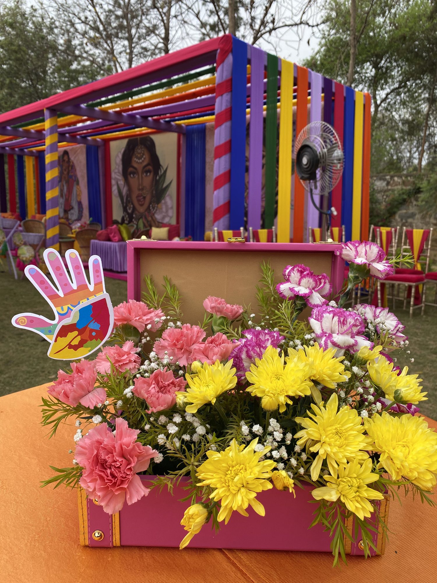 Colourful floral centerpiece in pink planter