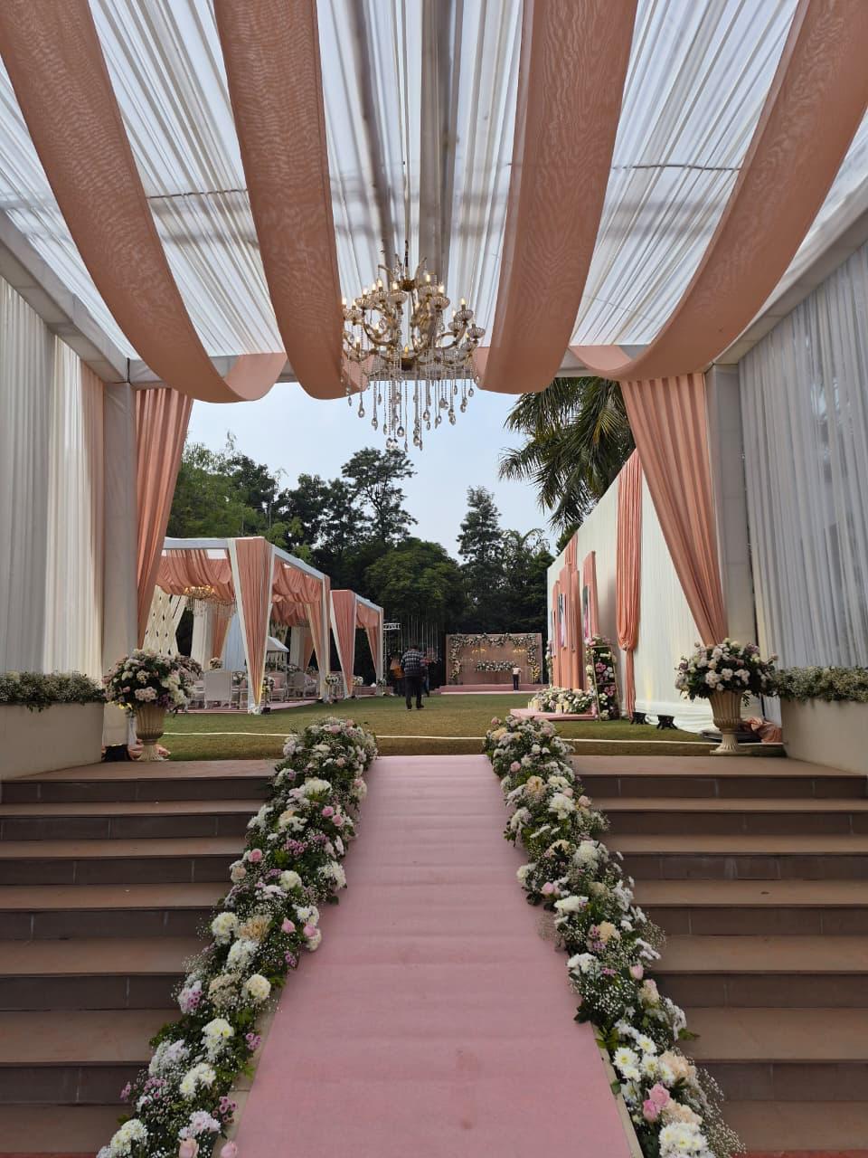 Rose-lined wedding aisle walkway