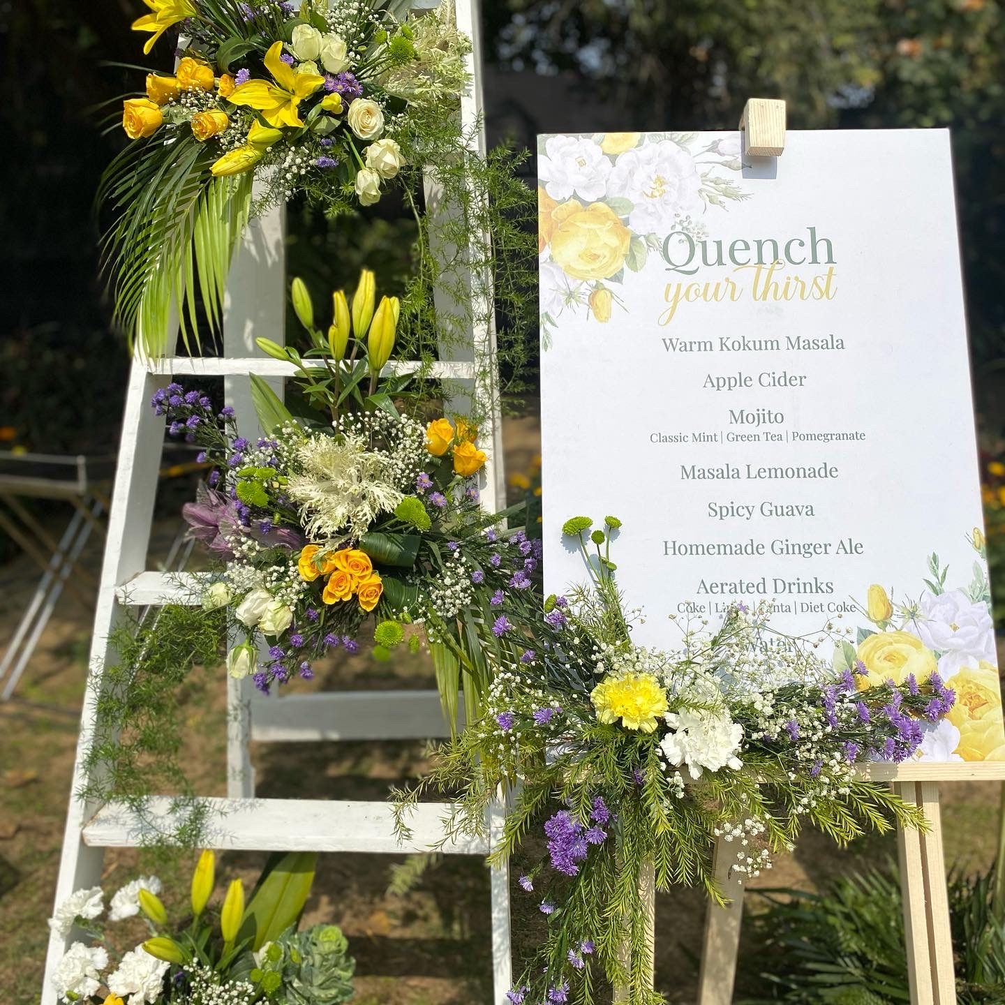 Welcome drinks signage with tropical florals