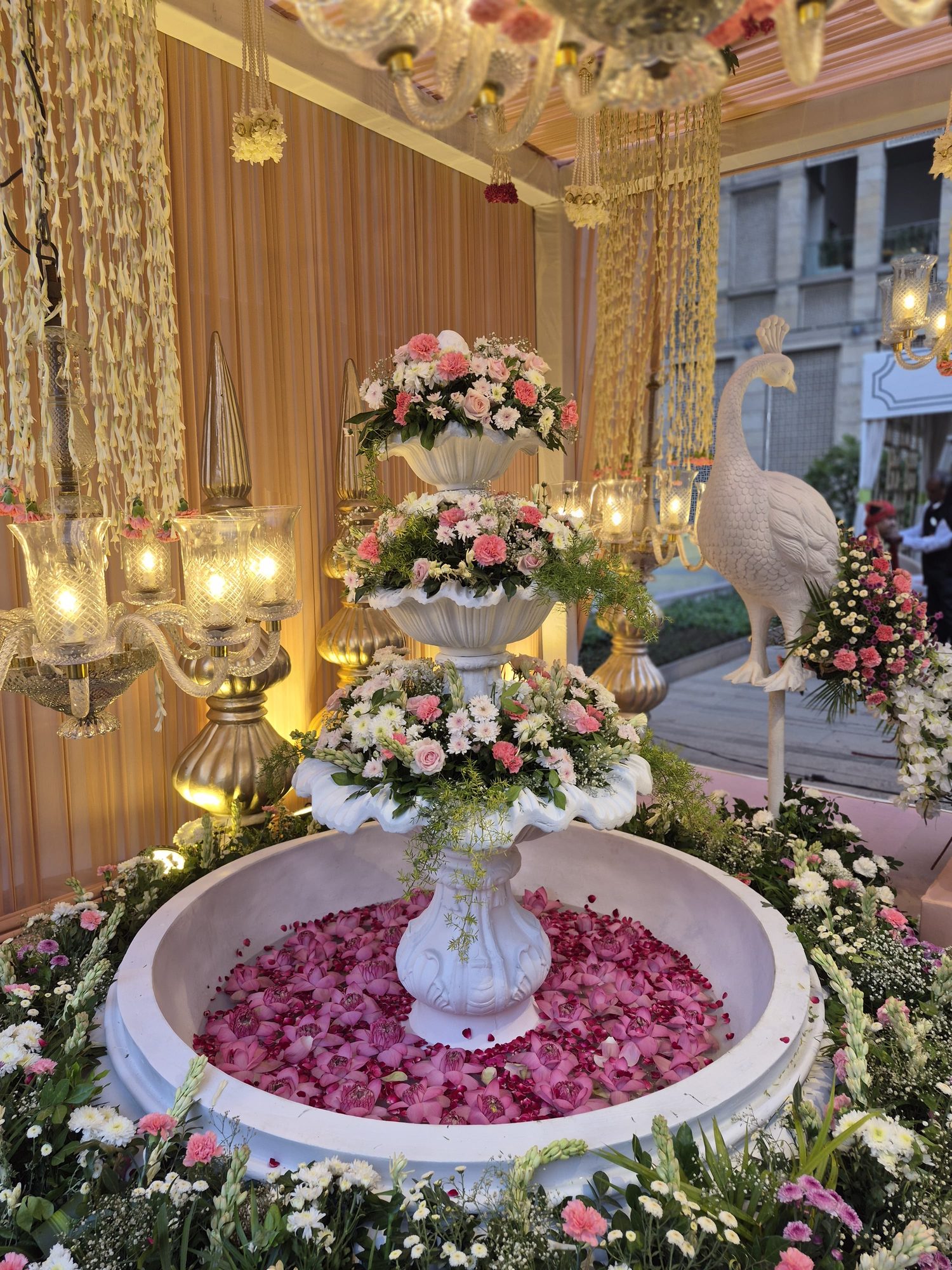 Floral fountain centerpiece with rose petals