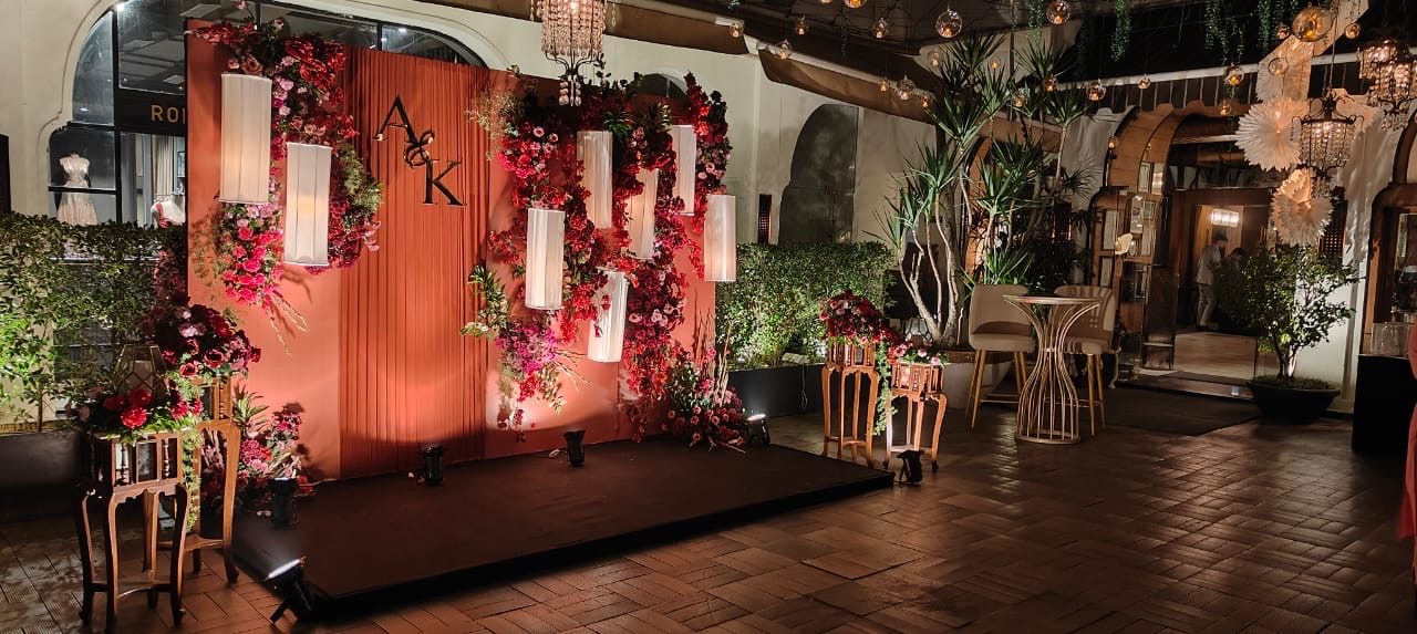 Red and maroon floral backdrop at night