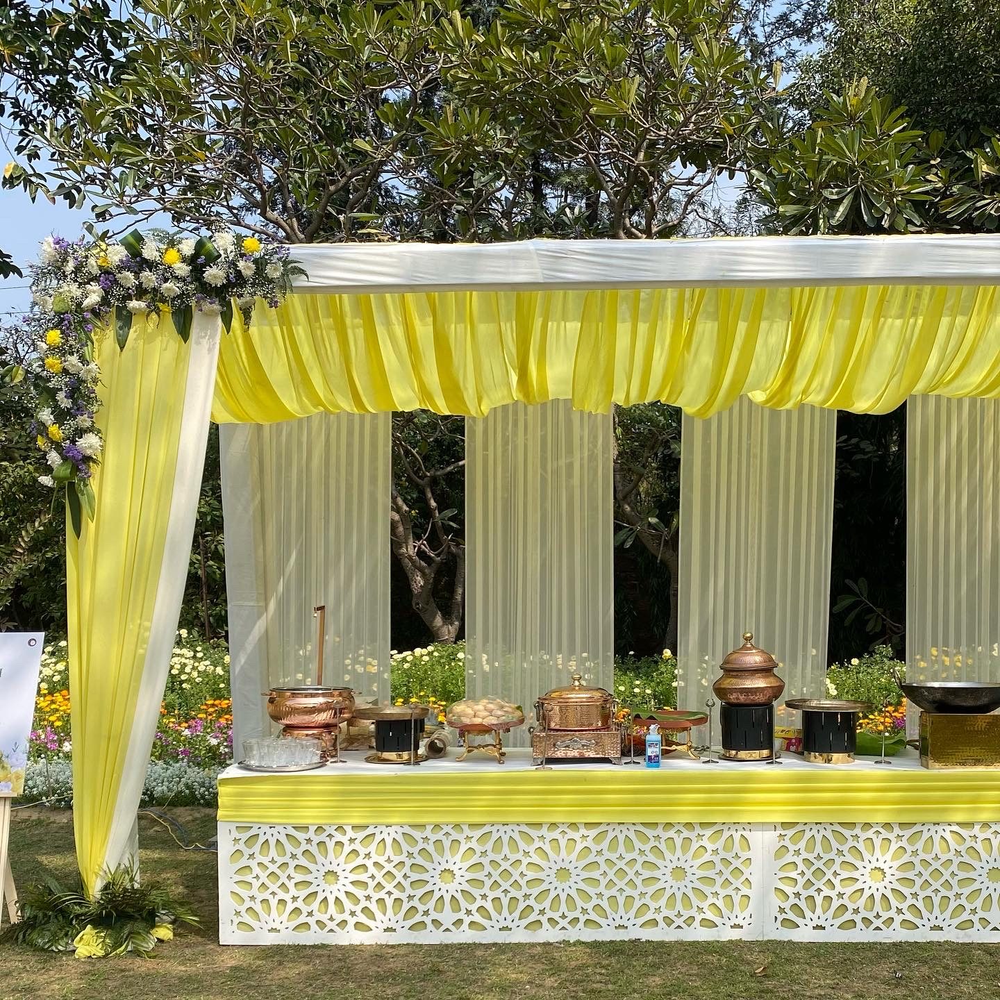 Peach-draped wedding reception tent