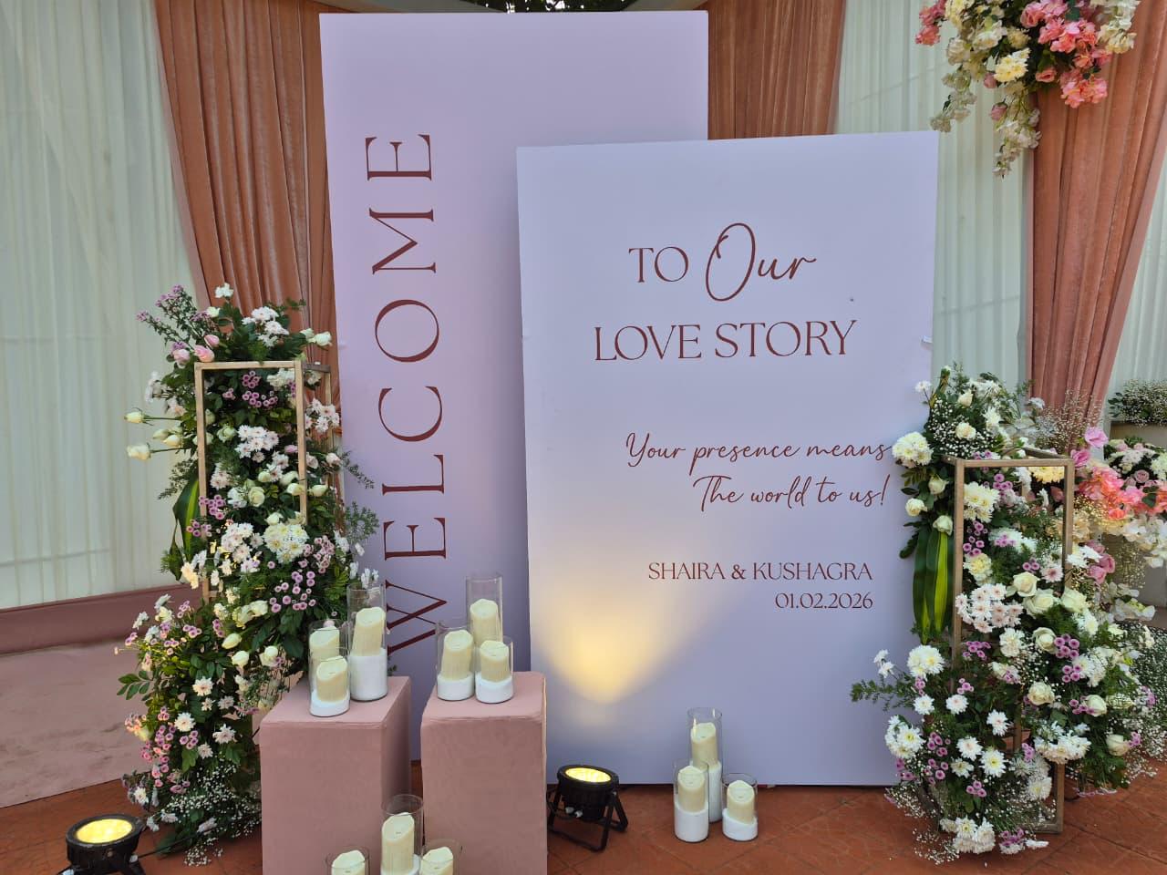 Welcome and love story signage with florals
